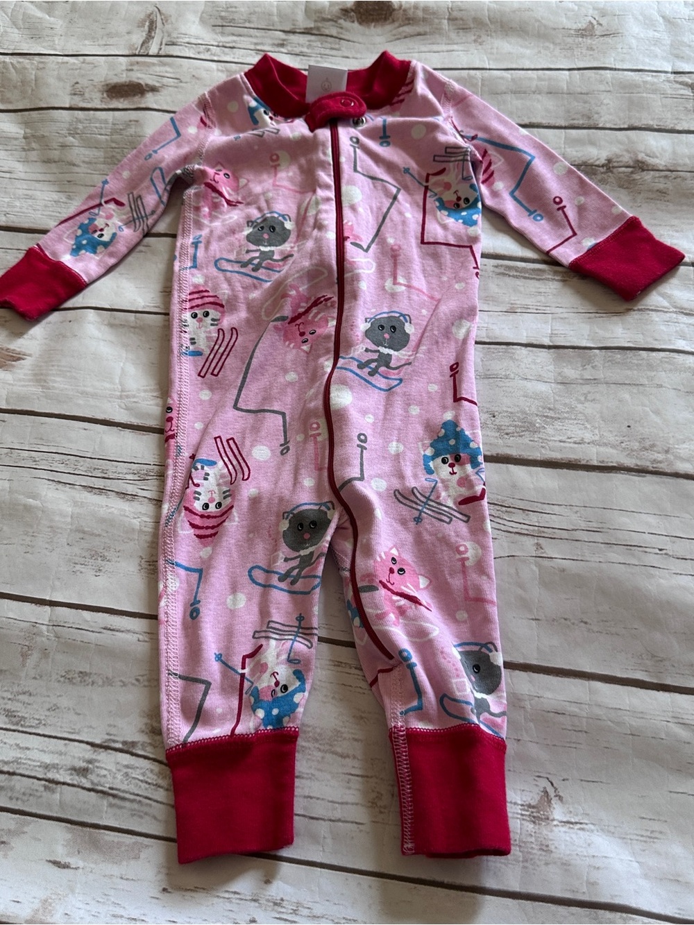 Hanna Andersson pink cat sleeper with red trim, vguc size 6-9 months.
